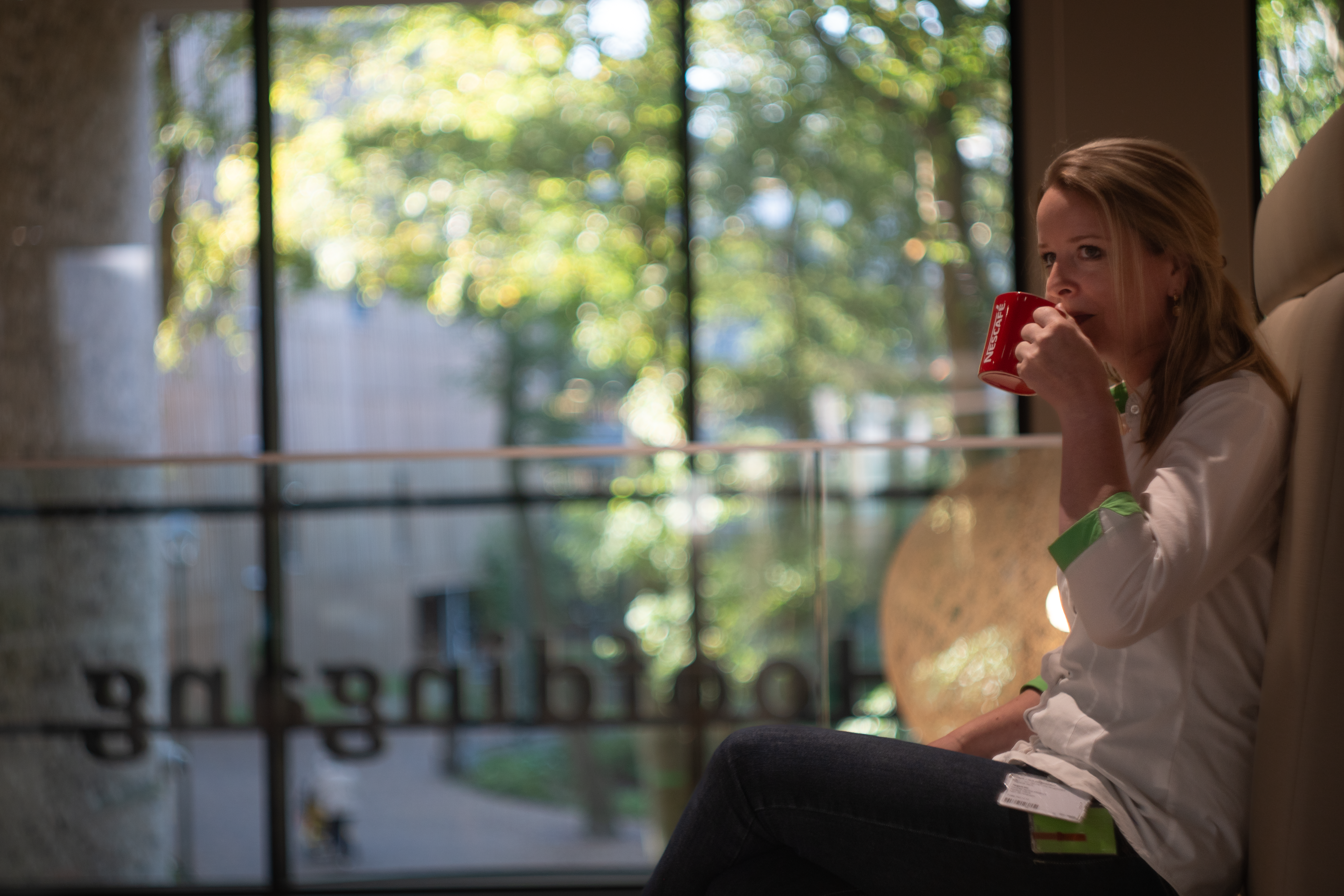 Woman drinking NESCAFE