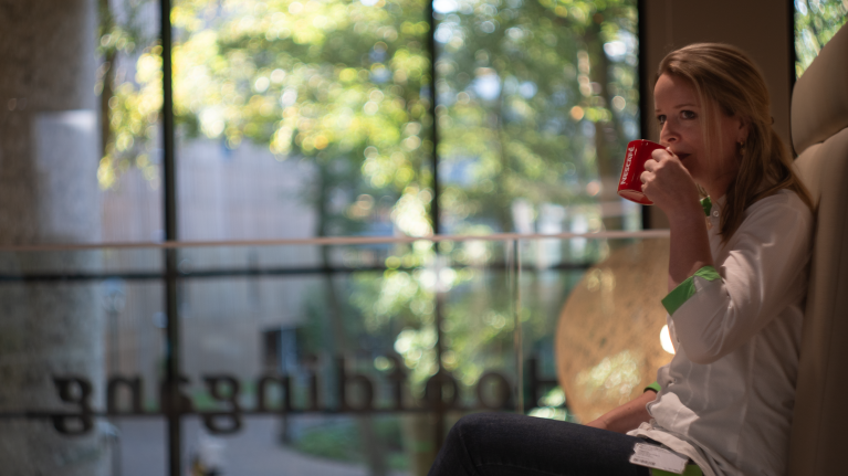 Woman drinking NESCAFE