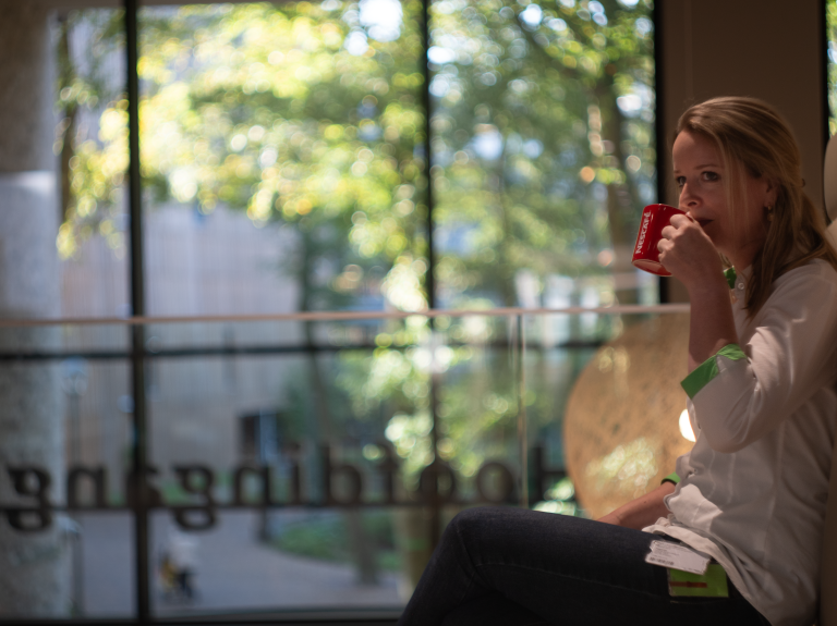 Woman drinking NESCAFE