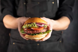 Chef kok met hamburger